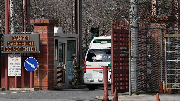 Image: An ambulance drives through the main gate of US Army Camp Carroll in Image: An ambulance drives through the main gate of US Army Camp Carroll in