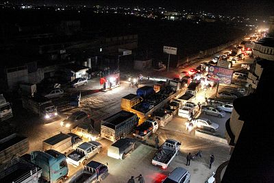 Heavy traffic flow along the road between the towns of Sarmada and Dana, as people flee advancing Syrian government forces.