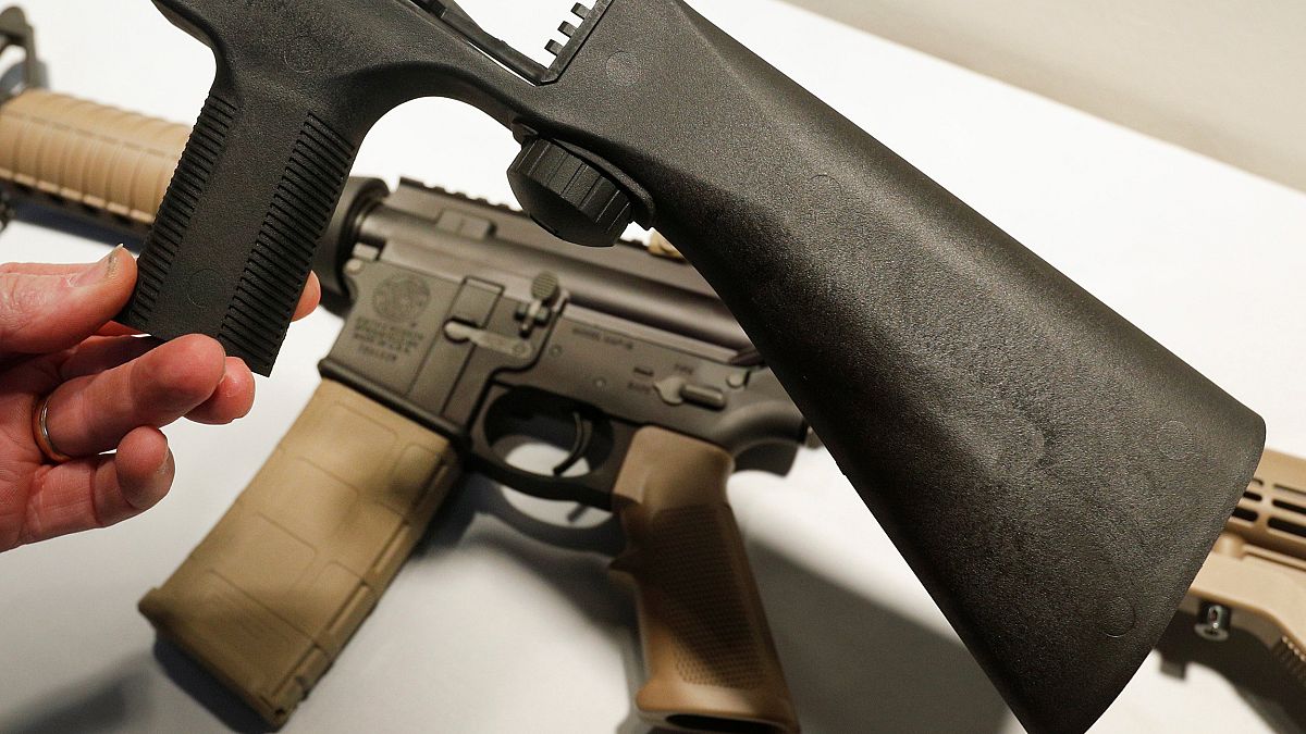 Image: A bump fire stock that attaches to an semi-automatic assault rifle t