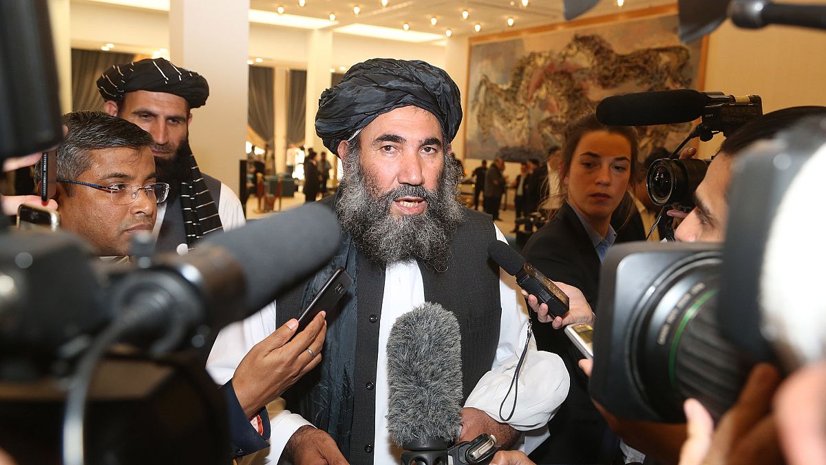 Image: Taliban leader Mullah Abdul Salam Zaeef, center, who served as ambas