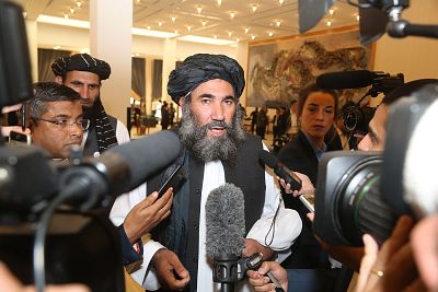 Taliban leader Mullah Abdul Salam Zaeef, center, who served as ambassador to Pakistan during the Taliban\'s rule, speaks to the media in Doha, Qatar, on Saturday.