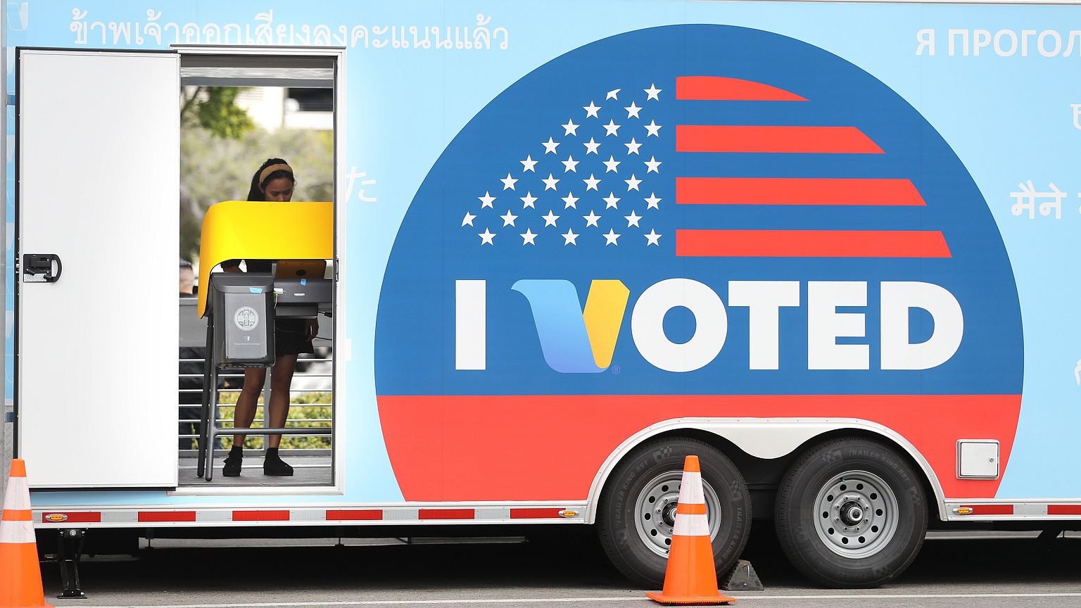 Image: A voter prepares her ballot during early Democratic primary voting i