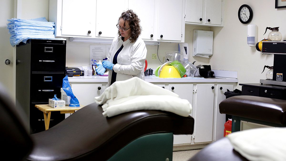 Image: Charla Roshto prepares the recovery room at the Hope Medical Group f