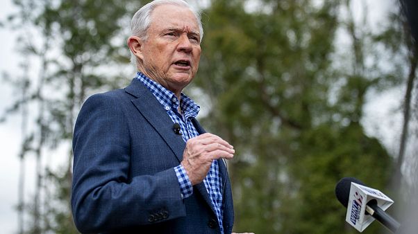Image: Jeff Sessions speaks to reporters after voting in Alabama's primary Image: Jeff Sessions speaks to reporters after voting in Alabama's primary