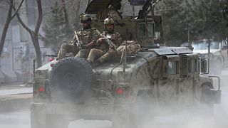 Image: Afghan security forces arrive at the site of an attack in Kabul, Afg