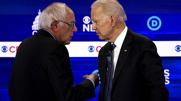 Image: Sen. Bernie Sanders and Joe Biden speak at a Democratic presidential Image: Sen. Bernie Sanders and Joe Biden speak at a Democratic presidential