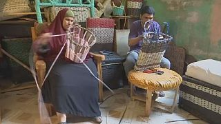 Visually impaired Egyptian couple making a living from weaving bamboo