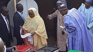 Photo: Buhari inspects who his wife voted for, Twitter reacts