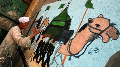Egypt: Artist paints hajj murals as muslims ready for trip to Mecca
