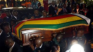 Photos: Stampede, tears as Zimbabweans flock Mugabe's funeral