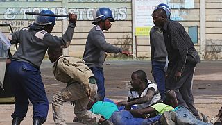 Zimbabwe police tear gas, batter opposition protesters