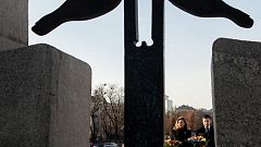 Ukrainian President Volodymyr Zelenskiy and his wife Olena visit a monument to Holodomor victims in Kyiv