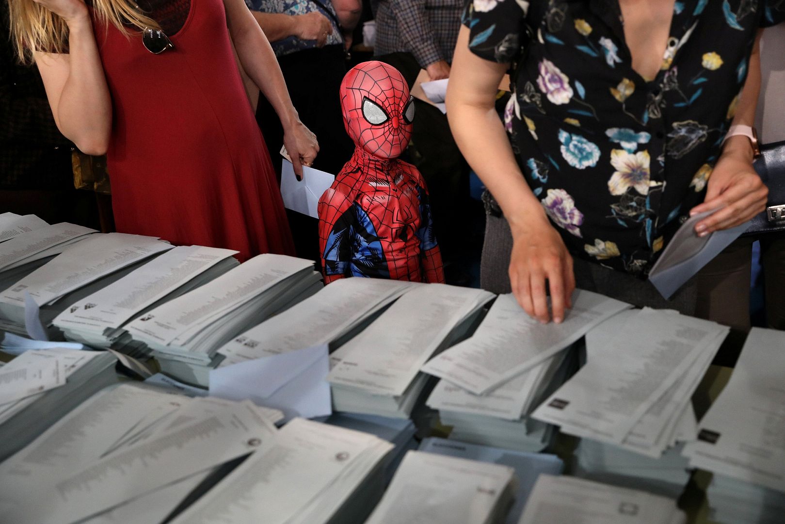 Spiderman stands next to ballots for EU election in Madrid
