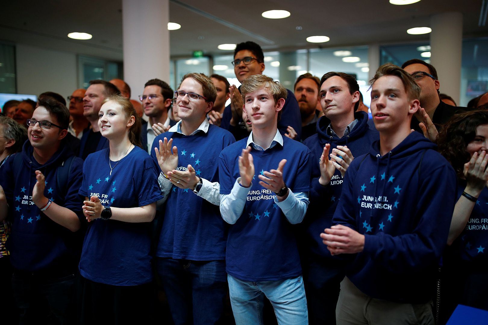 People at German CDU headquarters react on first exit poll results
