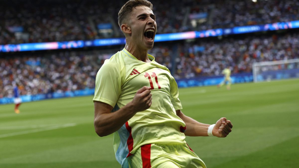 Spain's Fermin Lopez celebrates after scoring his goal during the men's footbalgold medal match between France and Spain at the Parc des Princes during the 2024 Summer Olympic