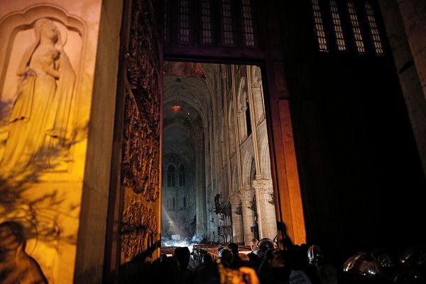 Smoke rising around the alter inside the Notre Dame Cathedral