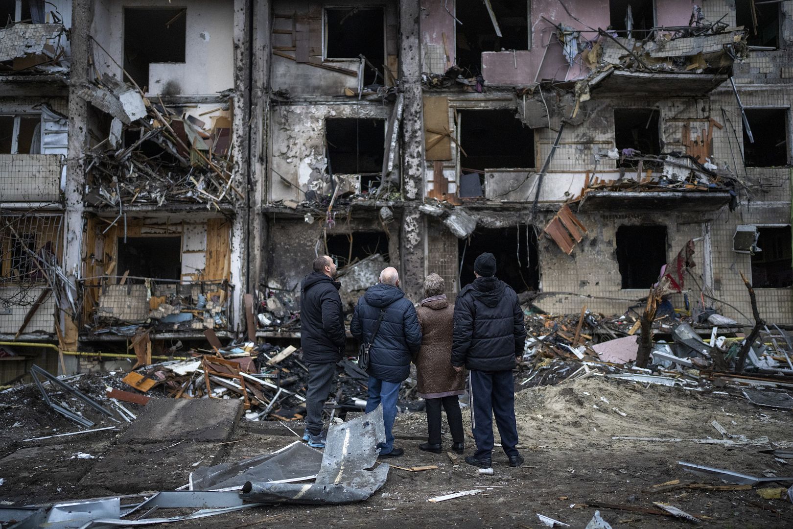 People look at the damage following Russia's rocket attack on Kyiv, Ukraine. February 25, 2022