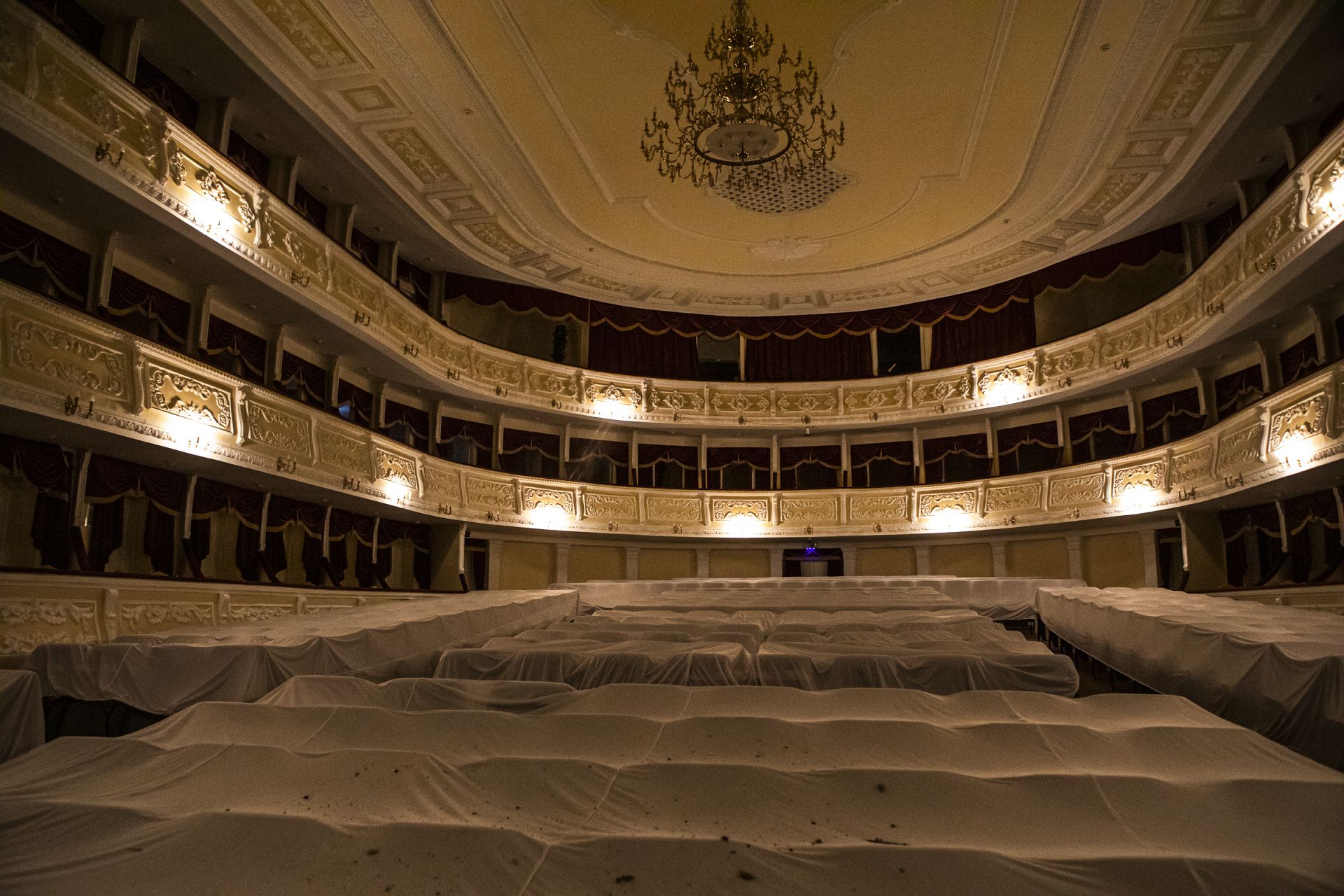 Mykolaiv Drama Theater, damaged by Russian missile attack, with seats covered to protect from falling debris. Mykolaiv, Ukraine. October 2022