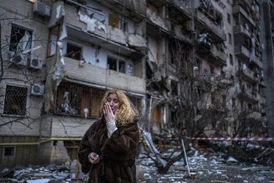 Kyiv resident Natalia Sevriukova cries next to her house following a rocket attack of Kyiv, Ukraine. February 25, 2022