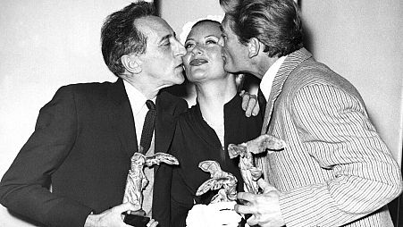 Jean Cocteau, left, and Jean Marias kiss Michèle Morgan whilst holding their awards at Cannes Film Festival in France on April 8, 1951.