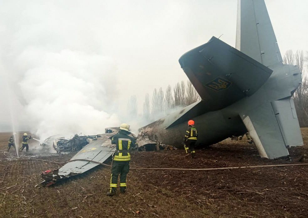 Emergencies personnel work at the crash site of a Ukrainian military plane south of Kyiv, Ukraine. February 24, 2022