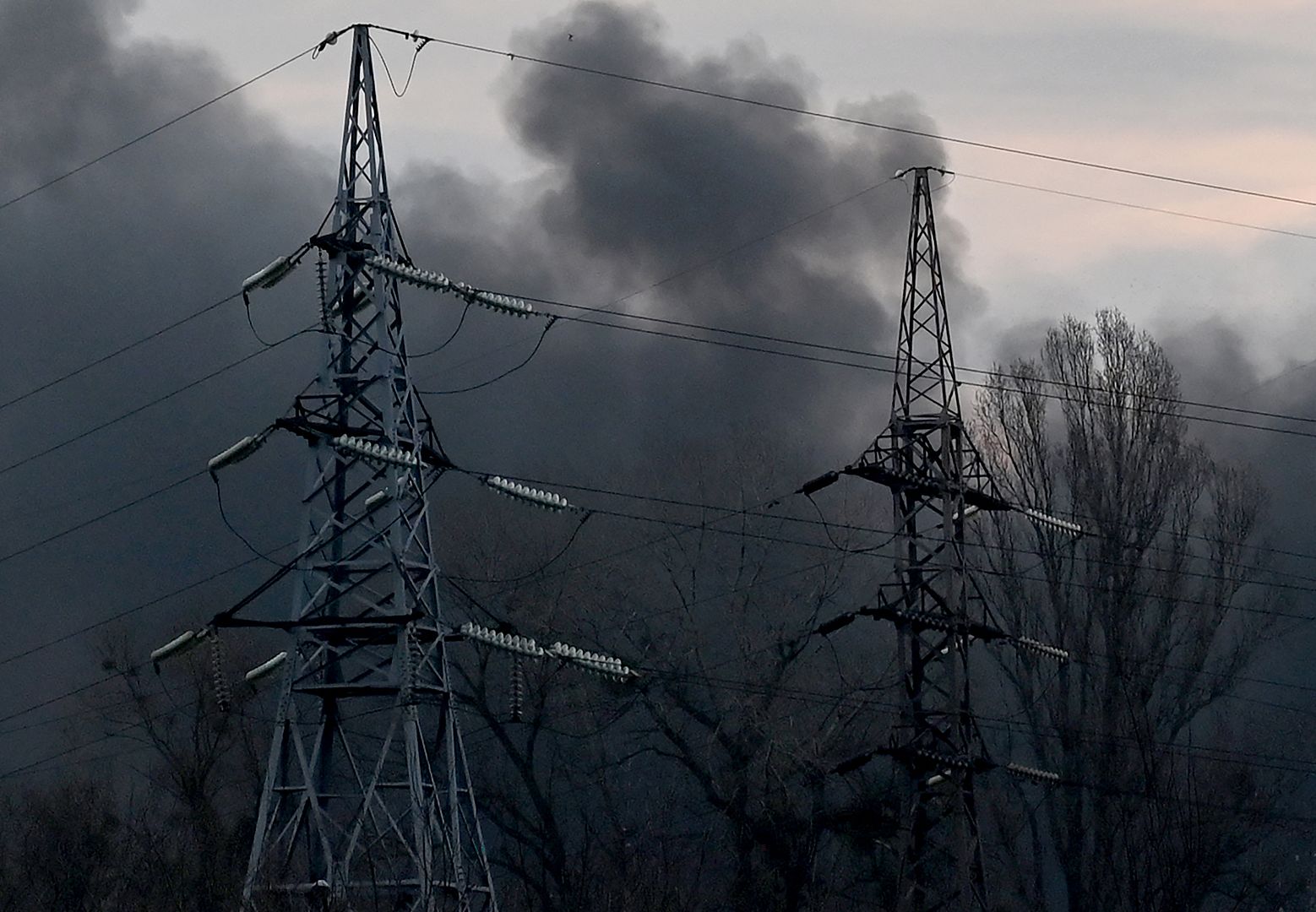 Smoke billows near electricity towers after a Russian missile strike in Kyiv, Ukraine. March 9, 2023