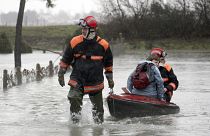 A resident of La Faute sur Mer, on the Atlantic coast in south western France is evacuated by firefighters as a result of a storm.