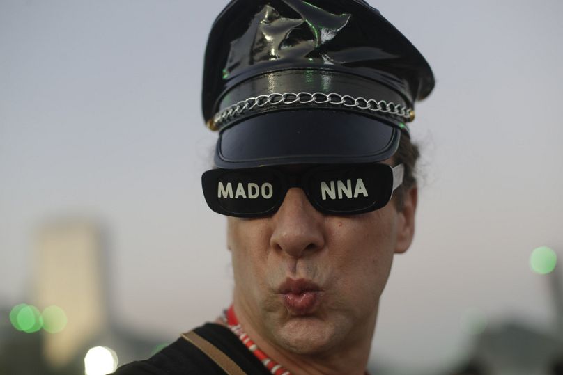 A fan wearing Madonna sunglasses on Copacabana beach ahead of her show on Saturday.