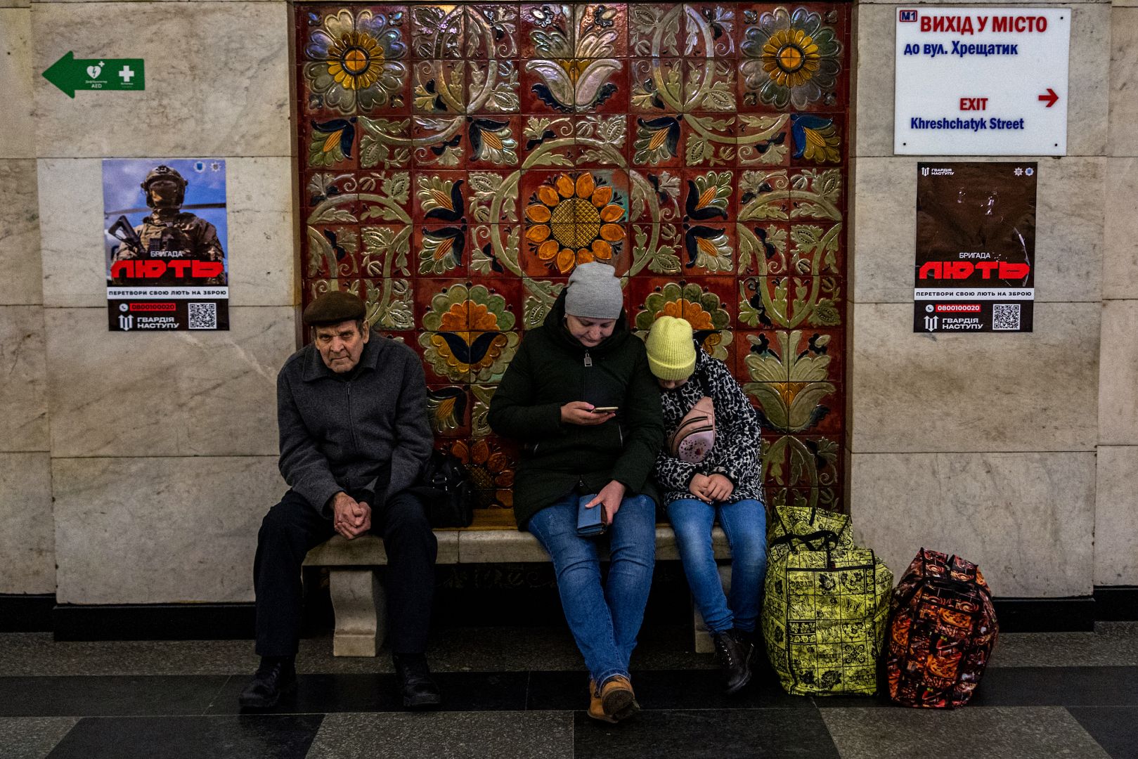Civilians take shelter at a metro station during a missile attack in Kyiv on March 9, 2023, amid the Russian invasion of Ukraine.