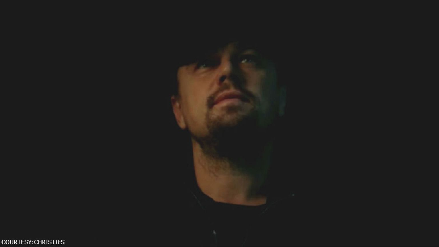 Leonardo DiCaprio looks at da Vinci painting