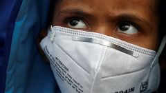 A child wears a face mask for protection from air pollution in Delhi