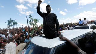 Kenyan opposition leader Raila Odinga greets supporters in Nairobi