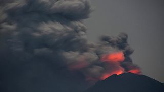 Mount Agung's mighty ash cloud hides rising molten lava