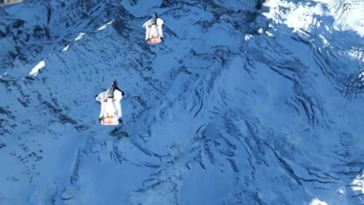 The daring stunt took place in the Swiss Alps
