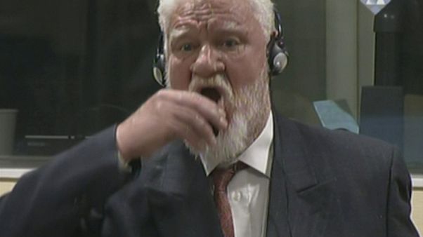 Wartime Bosnian Croat commander Slobodan Praljak, moments before his death. Wartime Bosnian Croat commander Slobodan Praljak, moments before his death.