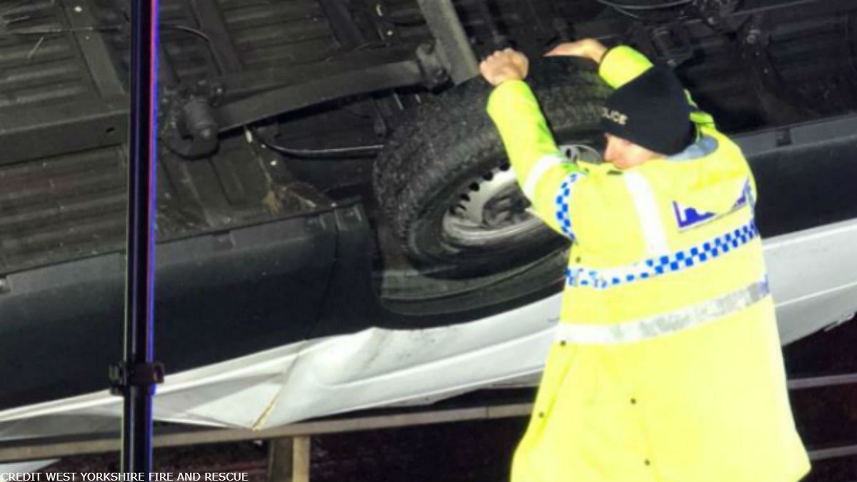 UK police officer stops van falling off bridge 