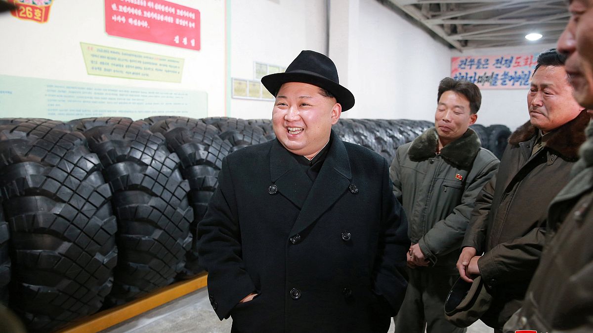 North Korea's leader Kim Jong Un inspects tyres at a factory 
