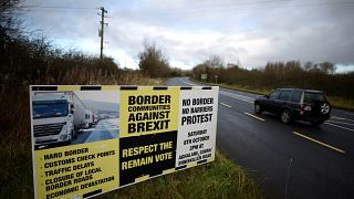 A sign from Border Communities Against Brexit is seen on the borderline bet