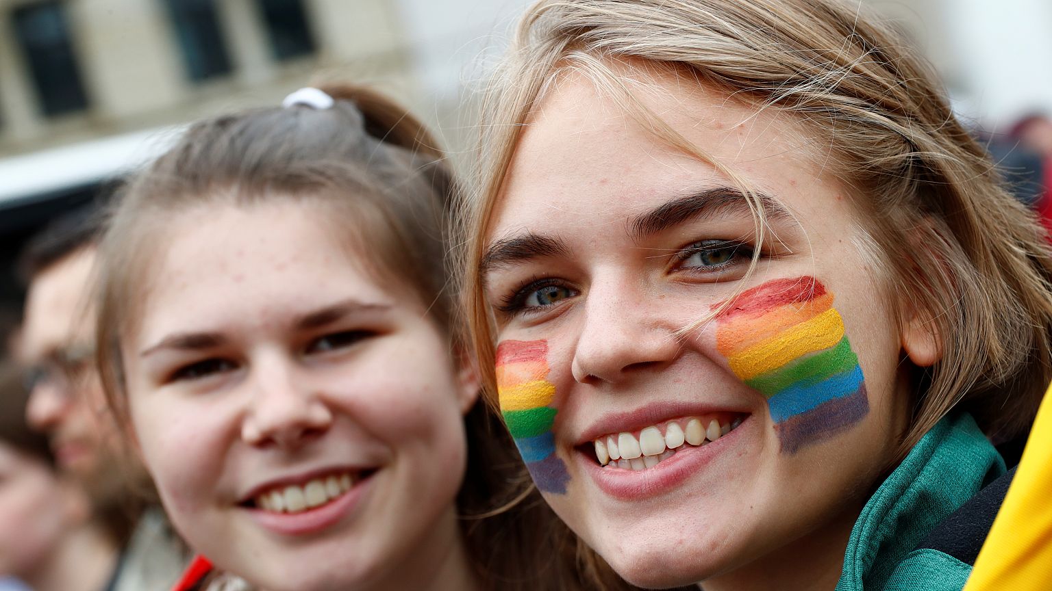 A lesbian couple poses for a picture as people celebrate Germany's parliame