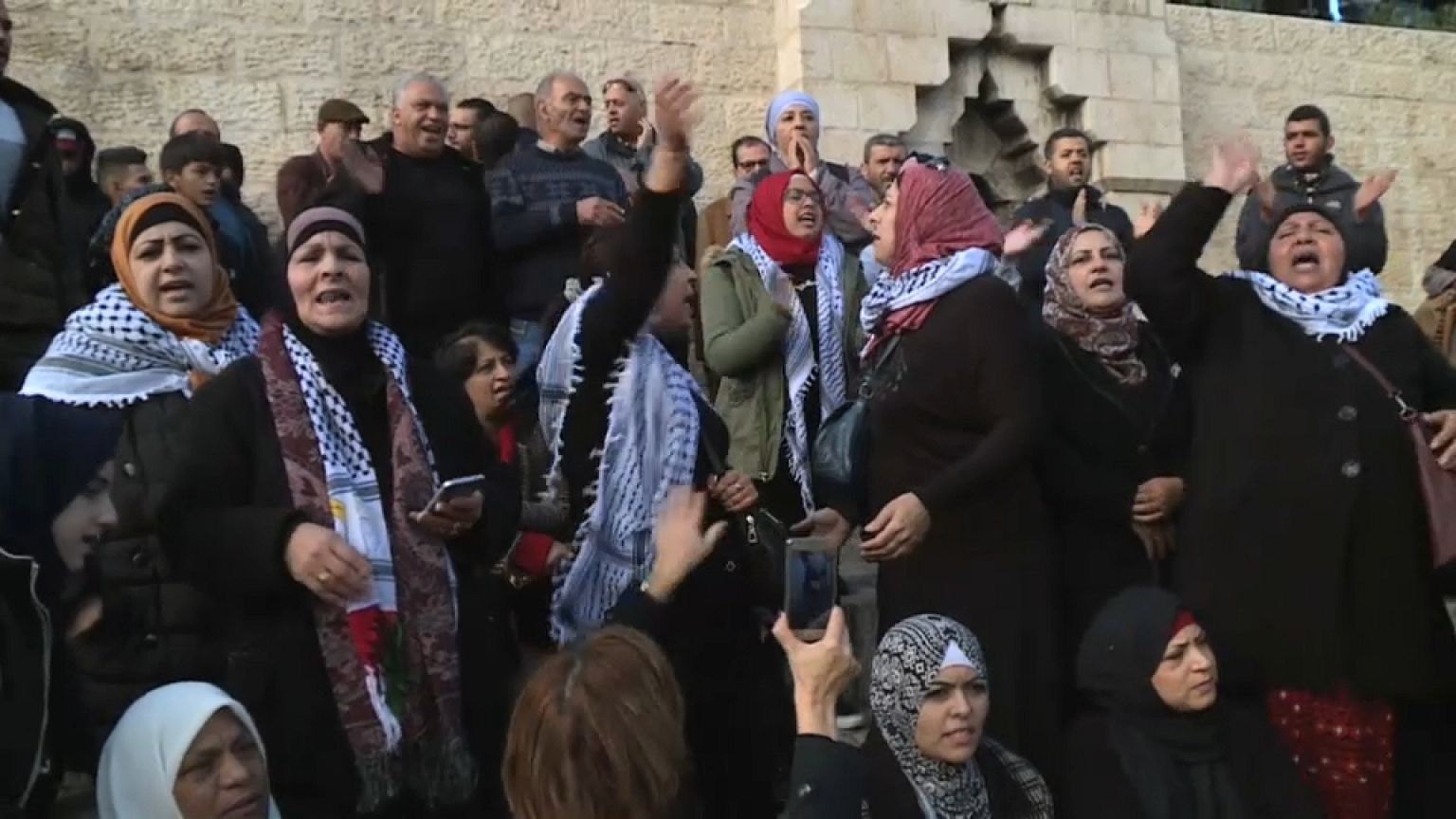 Gloom and defiance on the streets of East Jerusalem