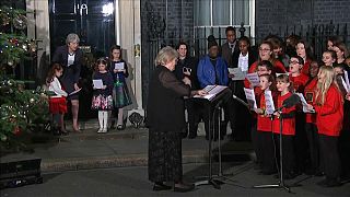 Theresa May singing carols