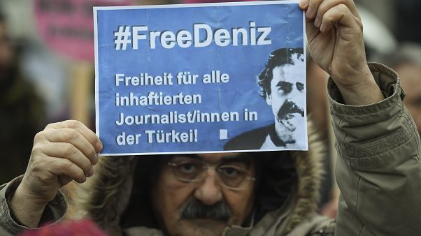 A protester demands the release of Deniz Yucel during a Hamburg rally A protester demands the release of Deniz Yucel during a Hamburg rally