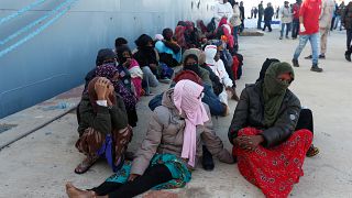 Migrants brought ashore by the Libyan coastguard
