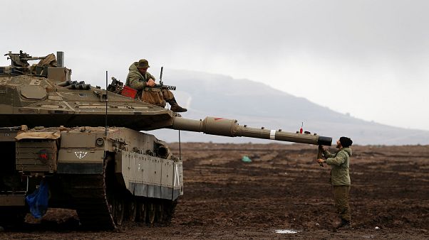 Israeli soldiers in the Golan Heights, close to the Syrian border Israeli soldiers in the Golan Heights, close to the Syrian border
