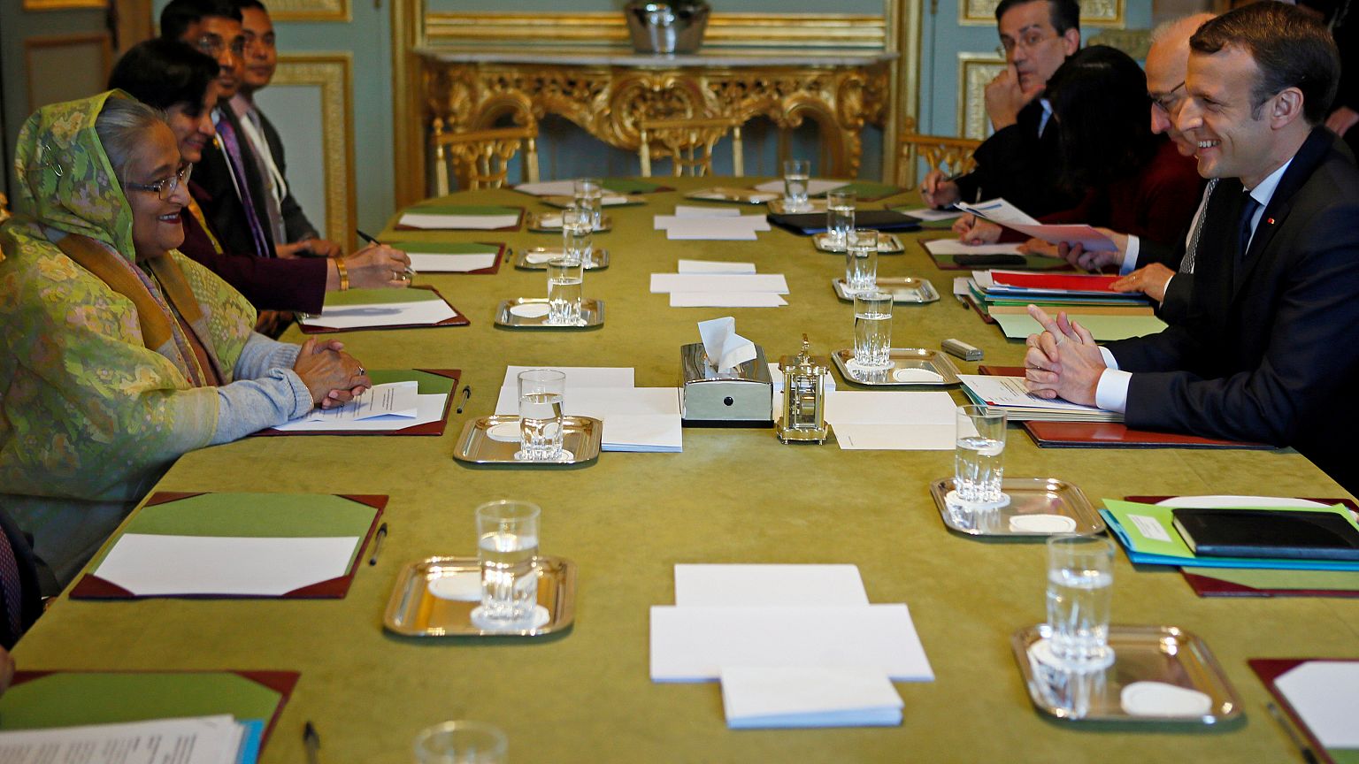 French President Emmanuel Macron (R) attends a meeting with Bangladeshi Pri