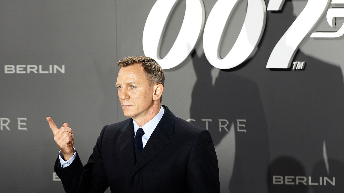 Actor Daniel Craig poses for photographers on the red carpet at the German 