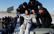 Three-man crew returns from space station
