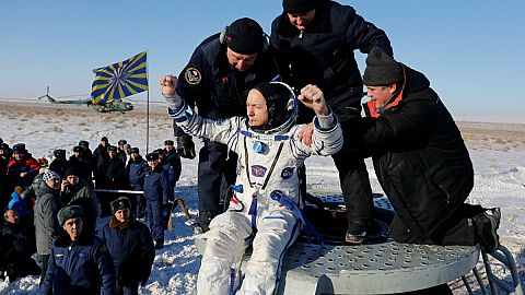 Three-man crew returns from space station