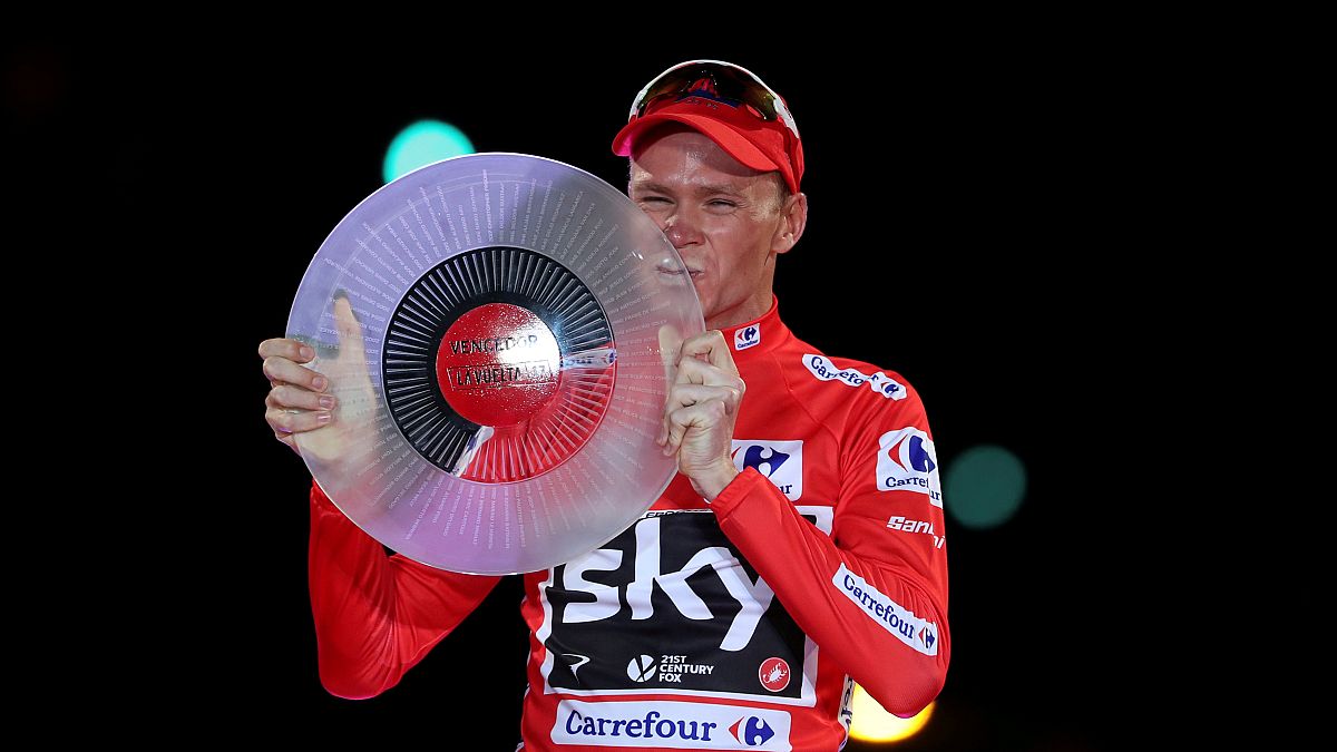 Froome posing with trophy