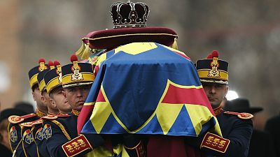 Soldiers carry the coffin of late Romanian King Michael during a funeral